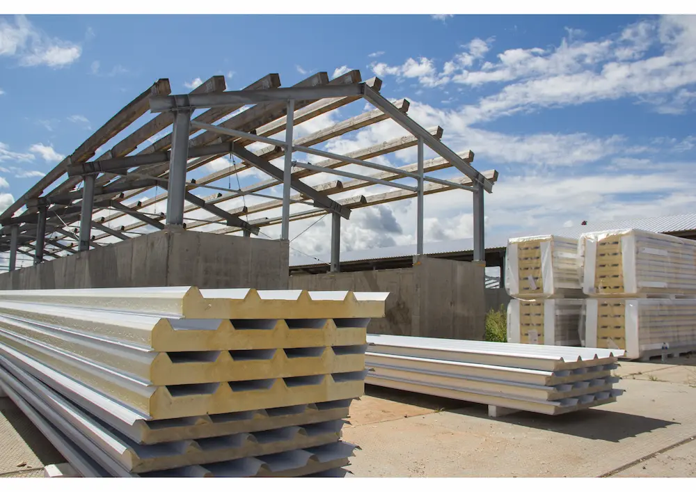 stock of sandwich panels on construction site